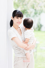 portrait of asian mother and baby in the park