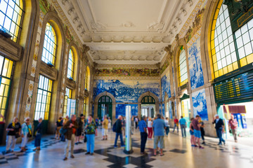 The train station San Bento in the city centre of Porto in Porugal in Europe full of tourist and...