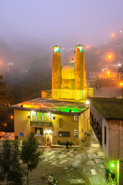 Masouleh and mosque at night in the fog