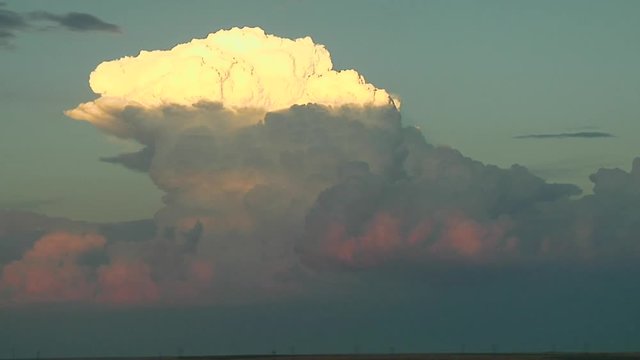 Thunderstorm With Exploding Updraft in Sunset
