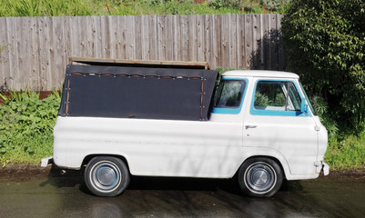 Classic early 1960s white van. Side view.