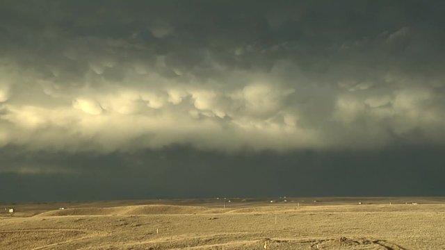 Mammatus Clouds and Rainbow over Colorado Plains ay Sunset