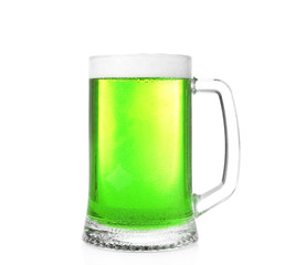 Mug with cold green beer on white background. Saint Patrick's Day concept