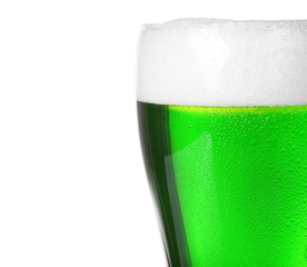 Glass with cold green beer on white background, close up. Saint Patrick's Day concept