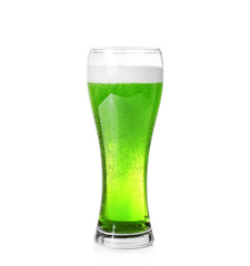 Glass with cold green beer on white background. Saint Patrick's Day concept