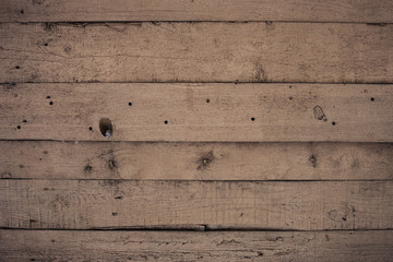 Wooden wall with paint is severely weathered and peeling