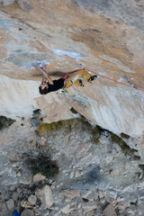 Outdoor activity. Extreme rock climbing lifestyle. Male rock climber on a cliff wall. Siurana, Spain.