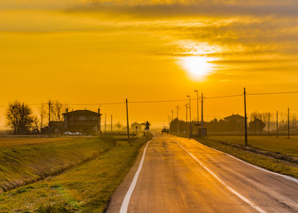 Dawn on tractor in the Italian countryside