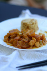 Thai pineapple chicken, rice on the side. Selective focus. 