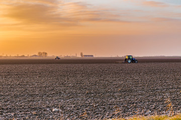 tractor plowing fields