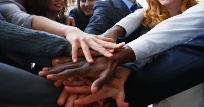 Businesspeople forming hands stack in the office 4k