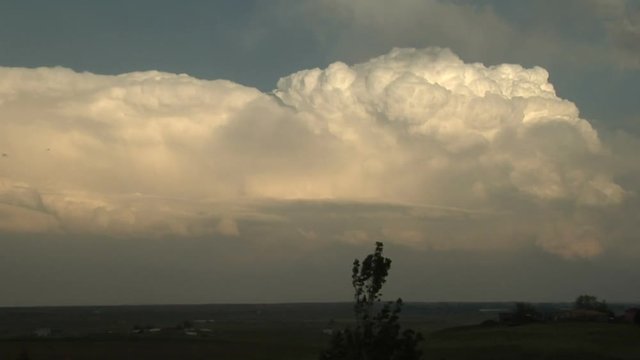 Supercell Thunderstorm Cloud Turret at Sunset