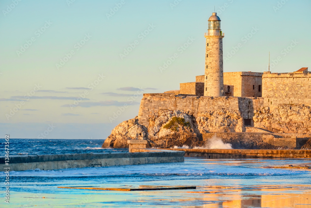 Wall mural El morro fortress and lighthouse in Havana at sunset