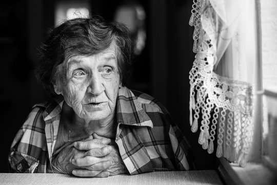Elderly woman black and white portrait.