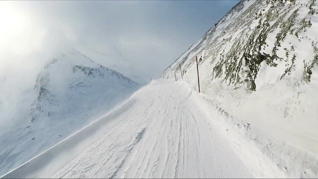 Snowboarding Passing Through Snowy Mountain Path In Winter