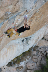 Extreme sport climbing. Rock climber struggle for success. Outdoor lifestyle. Siurana, Spain.