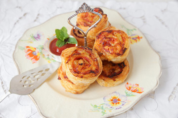 mini pizza rolls on vintage serving plate