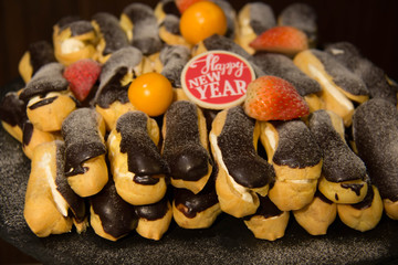  Chocolate eclair pastry on a black background