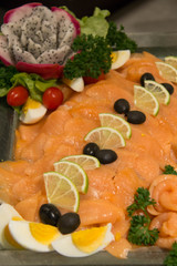  Salmon  pickled slices with herbs closeup
