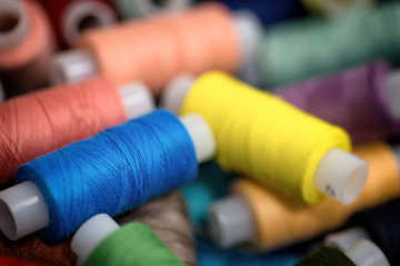 Reels of threads for embroidery. Colorful macro background.