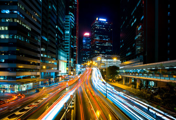 Fototapeta na wymiar Car light trails and urban landscape in Hong Kong