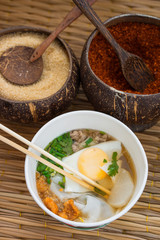 Asian cusine, a Noodle Soup with Egg, spices on background