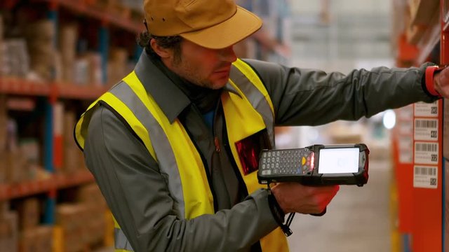 Male worker using barcode scanner