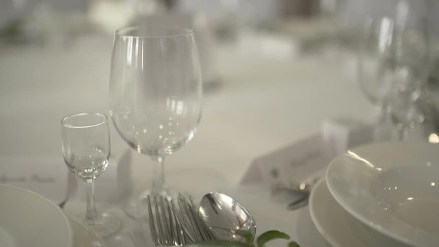 Table with wine glasses of wedding arrangement at he sunset.