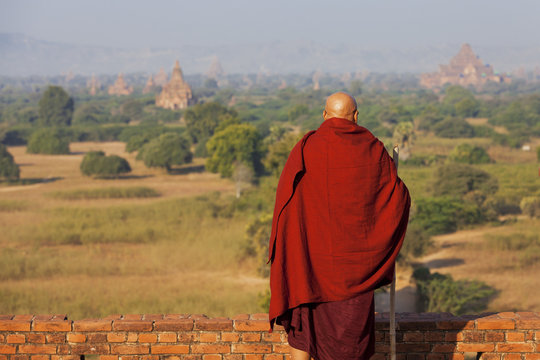 Monk looking at the temples in Bagan, Myanmar 