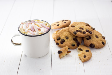 Cup of hot cocoa  with color marshmallow and oatmeal cookies