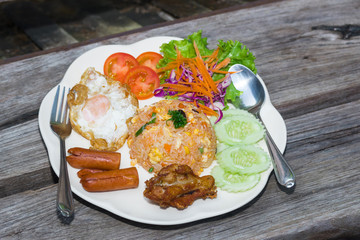 American fried rice on plate on wood table
