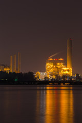 Fototapeta na wymiar electrical power plant near sea coat at night, Rayong, Thailand