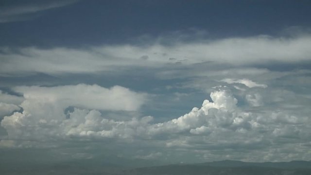 Small Thunderstorm Anvils form over Rocky Mountains