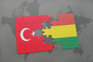 puzzle with the national flag of turkey and bolivia on a world map