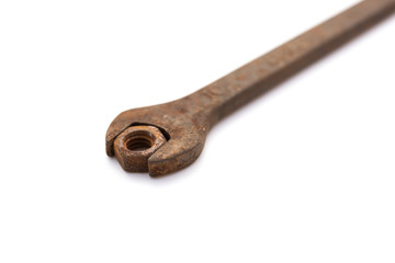 rusty nut and spanner on a white background