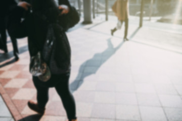 Obraz premium people walking in the street, (blur focus).