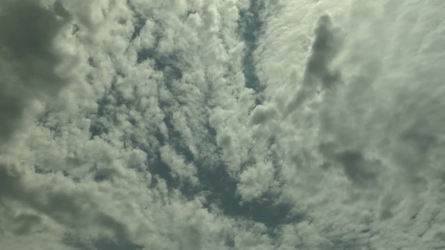 Altocumulus Clouds Wave Across Summer Sky