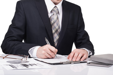Young businessman signing a contract in office. The concept of a successful business