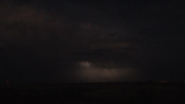 Lightning Threads Through Thunderhead at Night