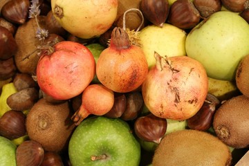 Naklejka na ściany i meble kiwi chestnuts pomegranates apples and many autumn fruits