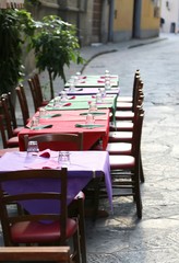 restaurant with the tables prepared along the pedestrian street
