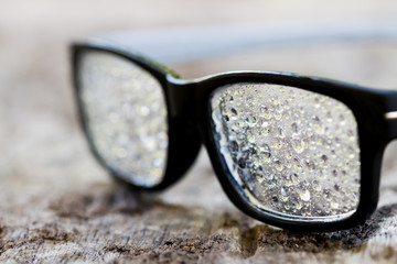 Glasses with raindrops on the lens
