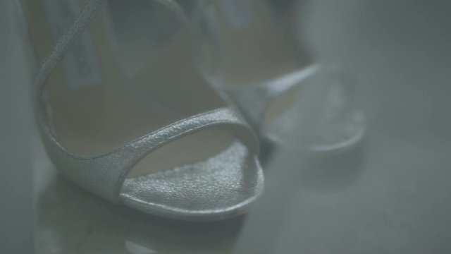 Dolly shot of Bride shoes on wedding day