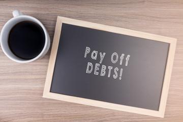 Pay Off DEBTS! word on chalkboard