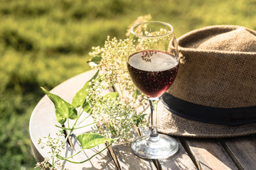 Glass of wine on the table  in park
