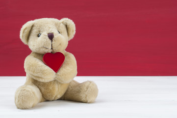 Little bear hold red heart. Valentines concept.