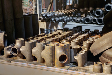 Steel Welded Tees Fitting In Warehouse Storage.