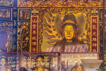 Beautiful Guanyin sculpture at Lungshan Temple of Manka,  Buddhist temple in Taipei, Taiwan. The temple was built in Taipei in 1738 by settlers from Fujian during Qing rule in honor of Guanyin.