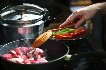 Cooking beef in a flying pan