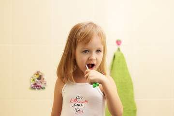 cute little girl clean teeth © alekseynikiforov